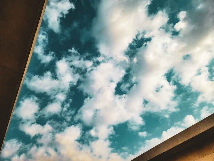 a brown house has the sky in front of it