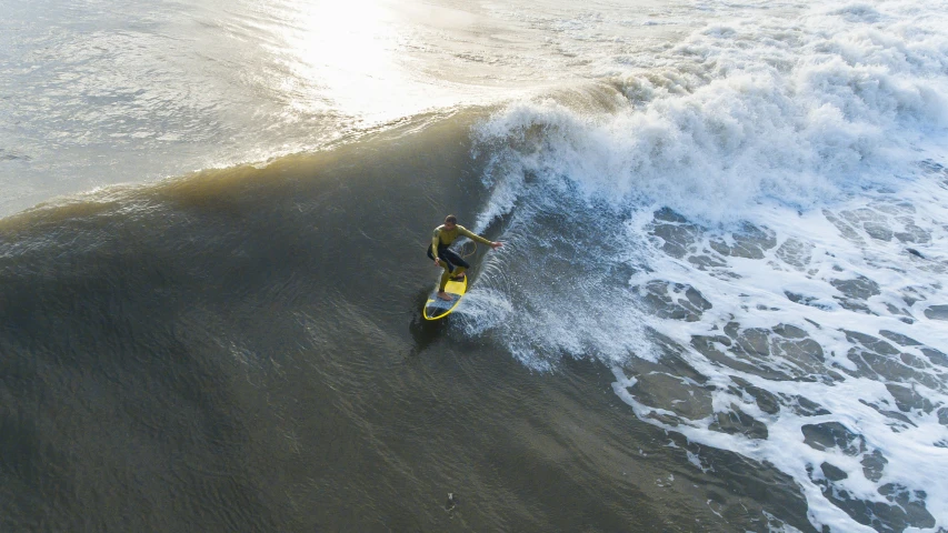 the surfer is riding the wave towards shore