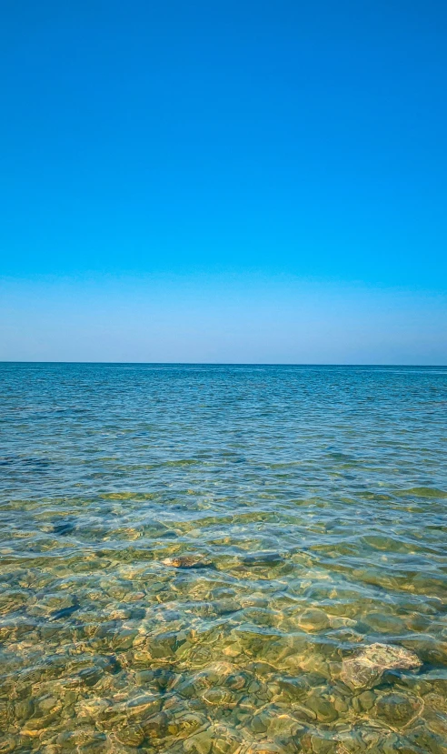 a boat on the ocean with a sky background