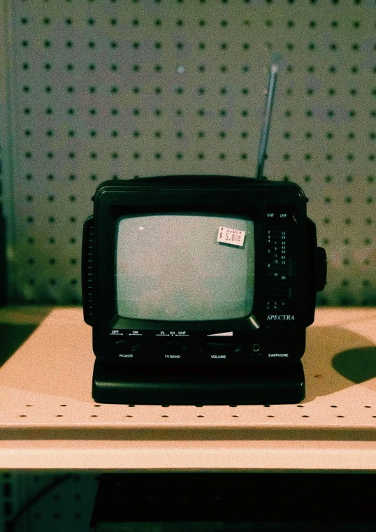 a black and silver tv sitting on top of a table