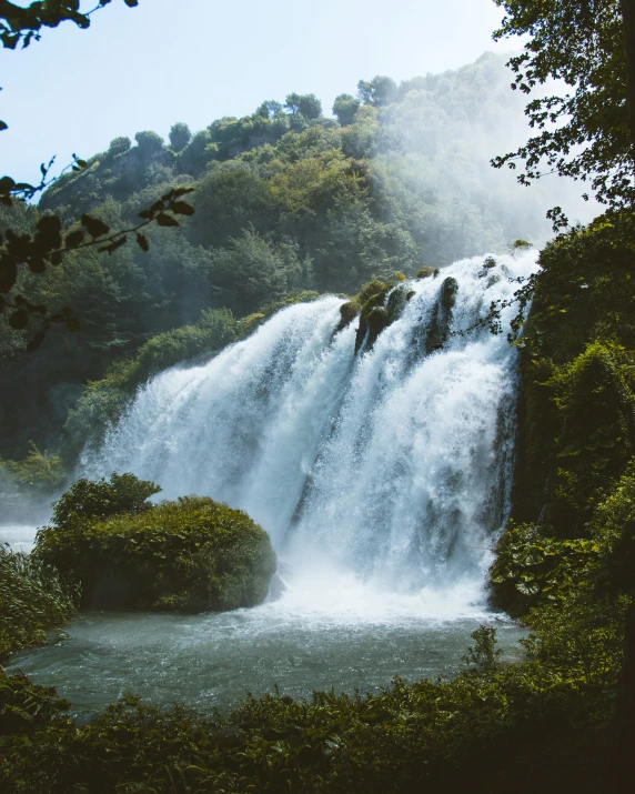 an extremely high waterfall with water falling out