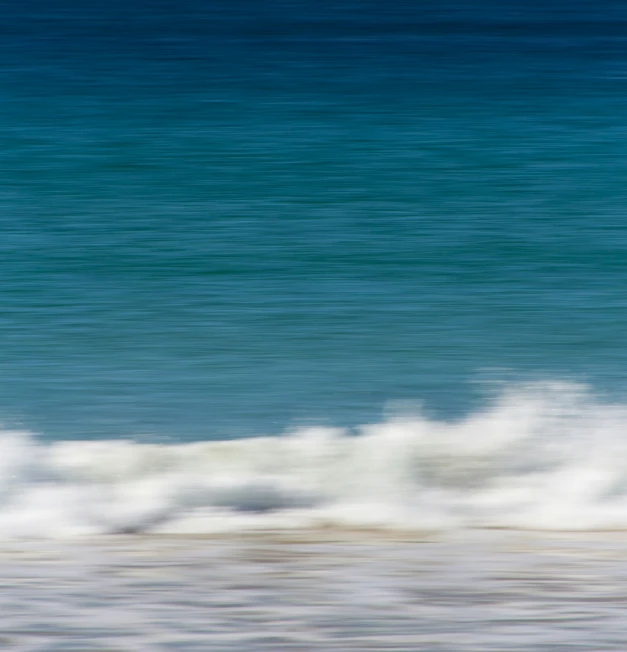 there is a surfer coming out of the water