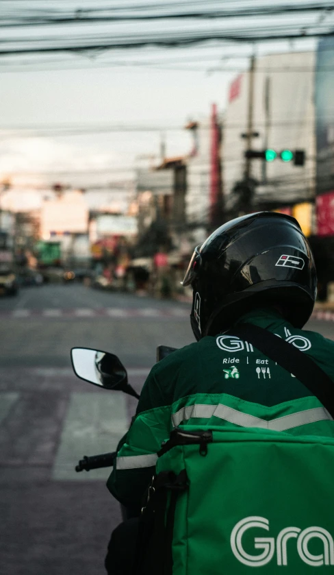 two people ride on the back of a motorcycle