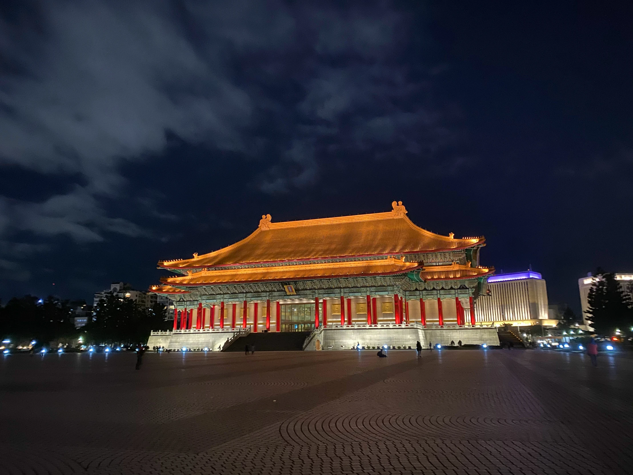 the building has red and gold columns in it