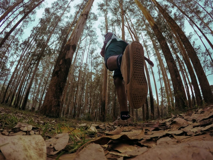 a person riding a board up the side of a cliff