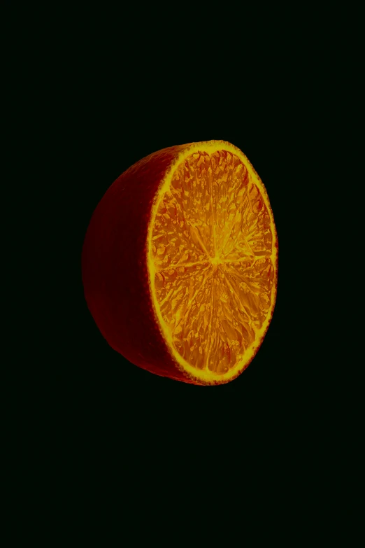 an orange in the dark is split into halves