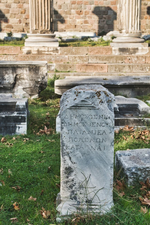 a graveyard with tombstones of men, women and children