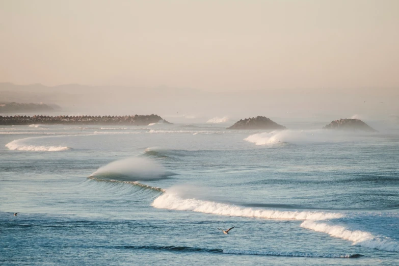 a surfer rides a wave in the ocean