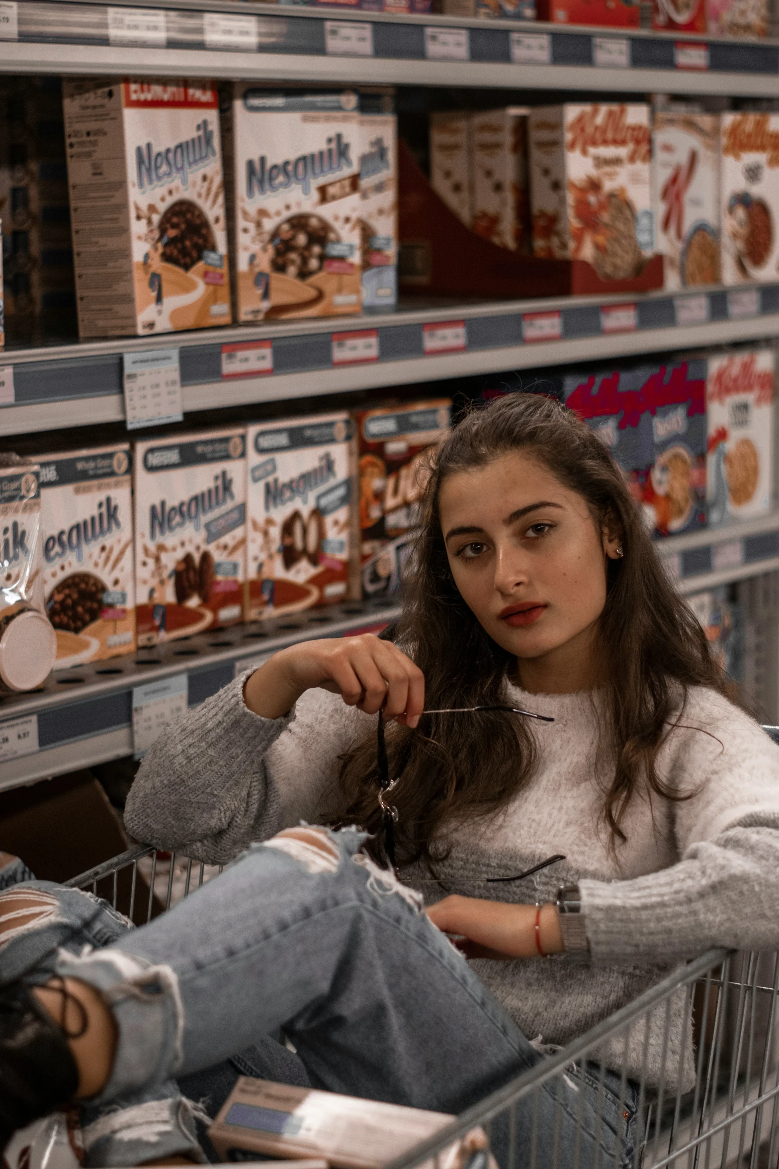 a woman holding a spoon and some food