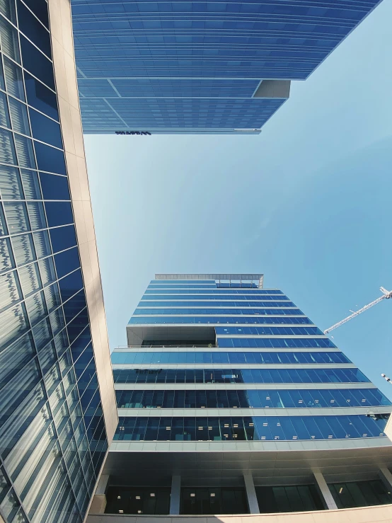 looking up at tall skyscrs from the ground