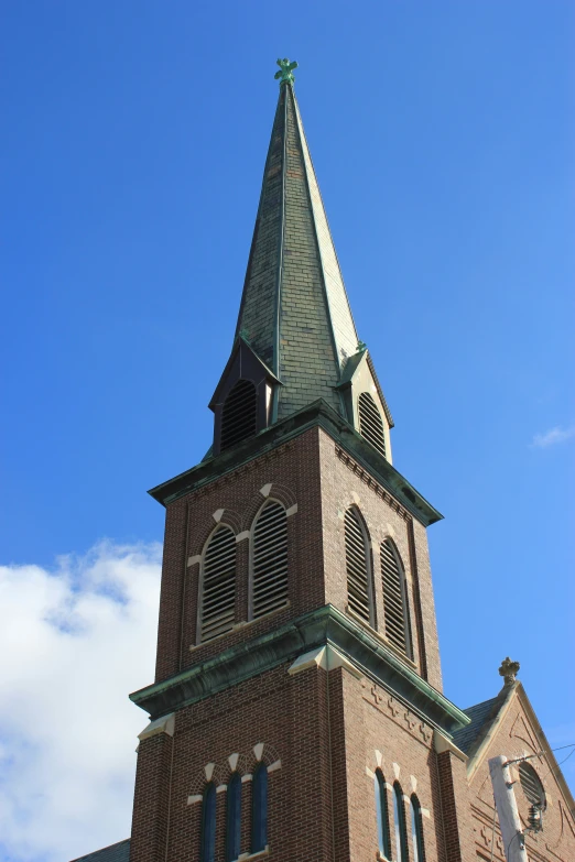 a large brick tower has a clock on it