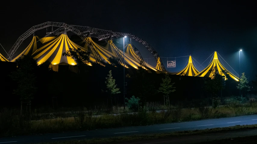 several lights that are lit up on a dark sky