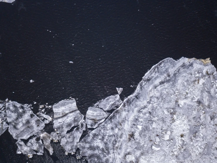 an ice filled field next to a lake