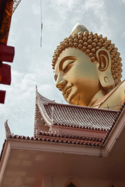 an image of a statue at the top of a building