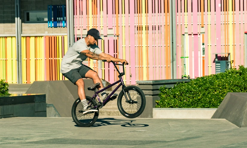 the young man is practicing his riding ss in front of an office building