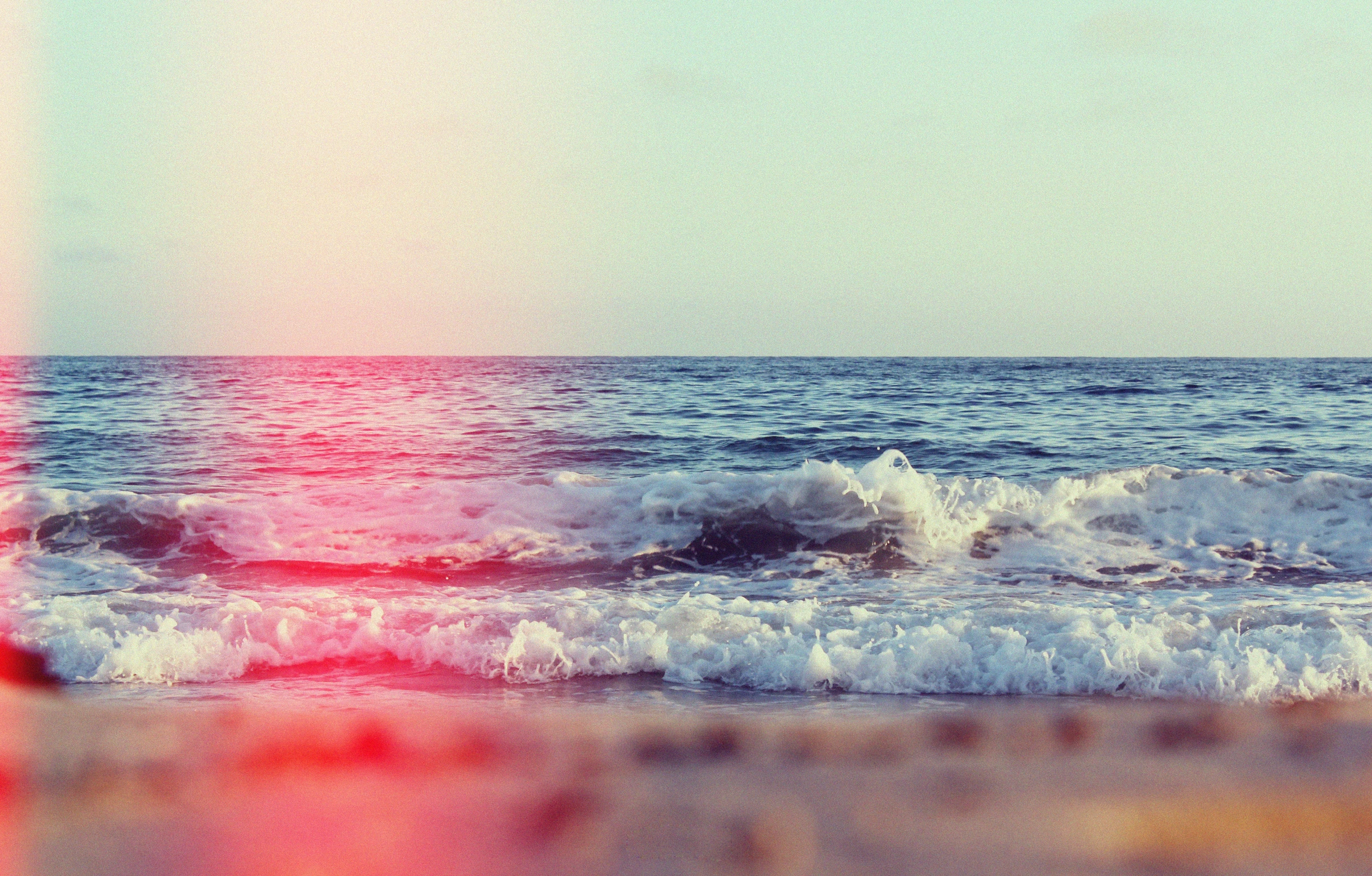 a picture of waves and the sky from an ocean