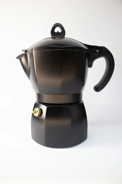 a black coffee maker with a cup on it