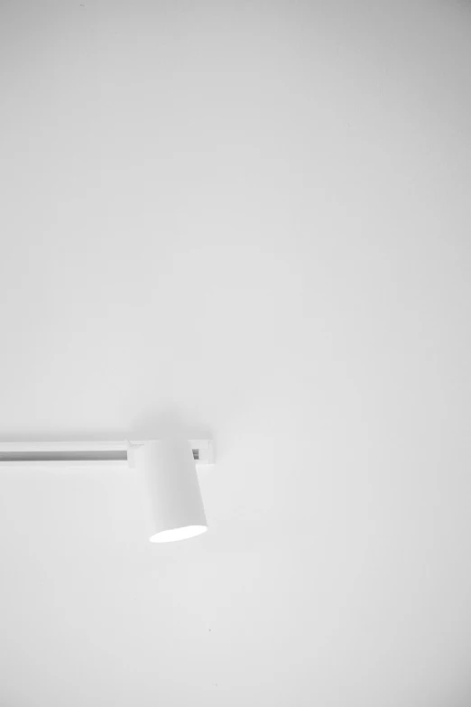 an open white door with light coming from behind