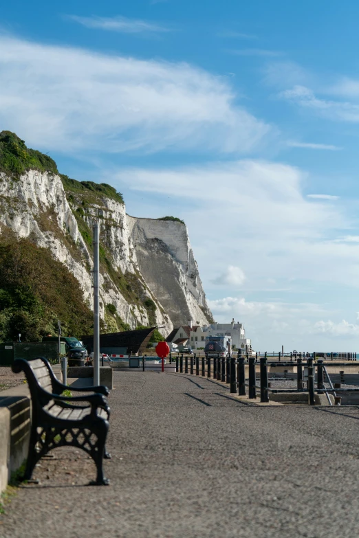 the wooden bench is overlooking the rocky cliff