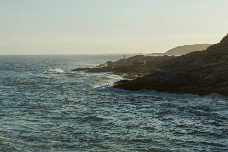 a boat is on the choppy blue water