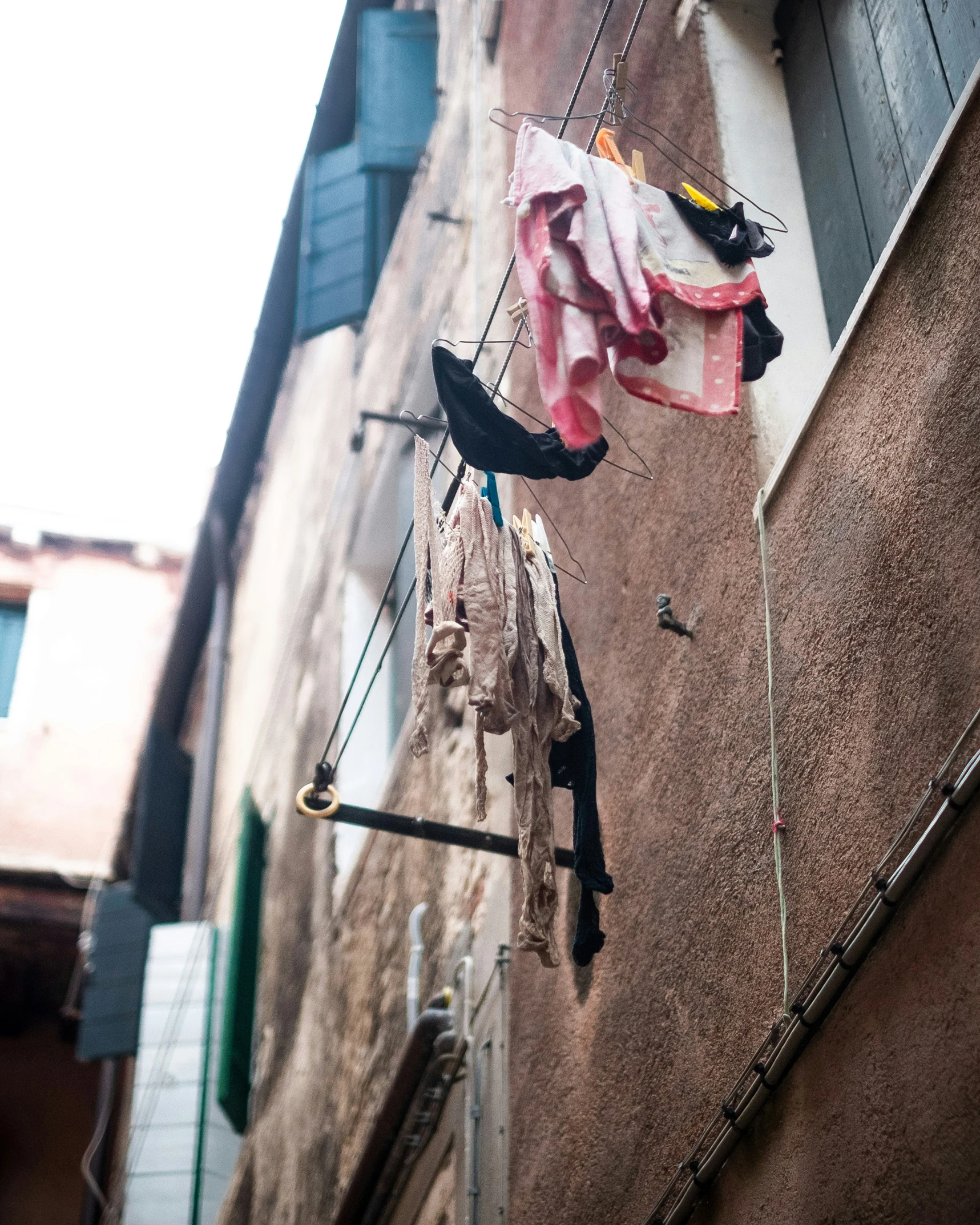 a hanging laundry line with clothes and laundry items on it