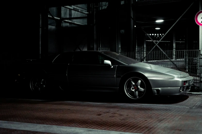 a very nice car in a dimly lit area