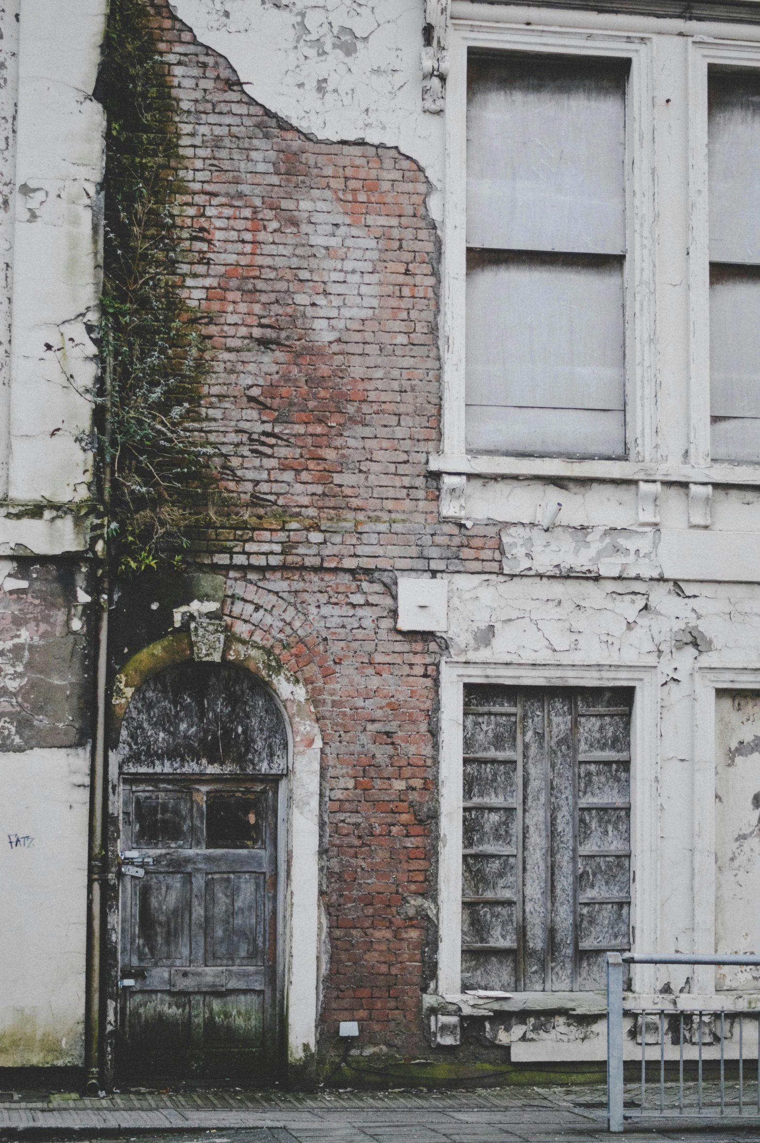 an old building with ivy growing on it's side