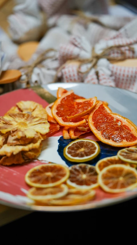 some very pretty plate with some cut up oranges