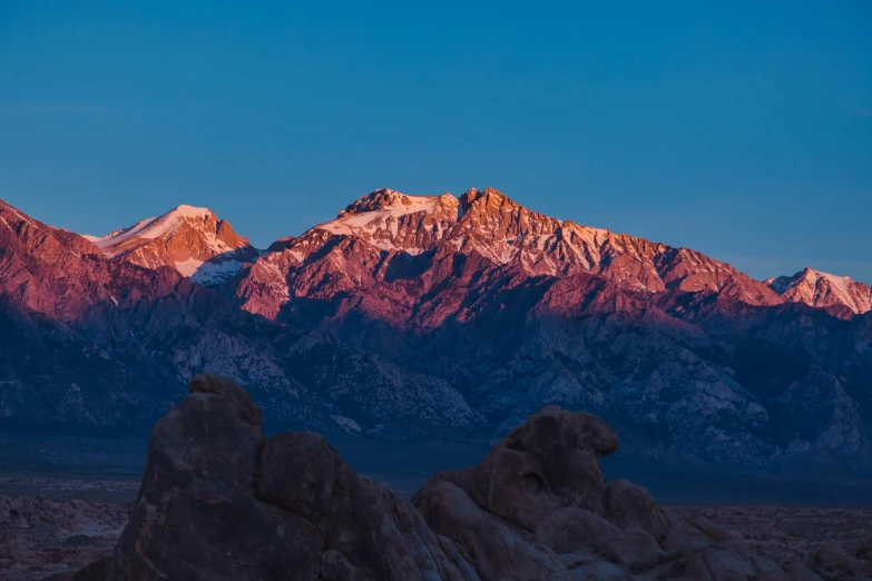 an image of mountains at night with snow on them