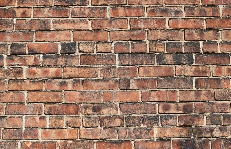 a red brick wall with very little s