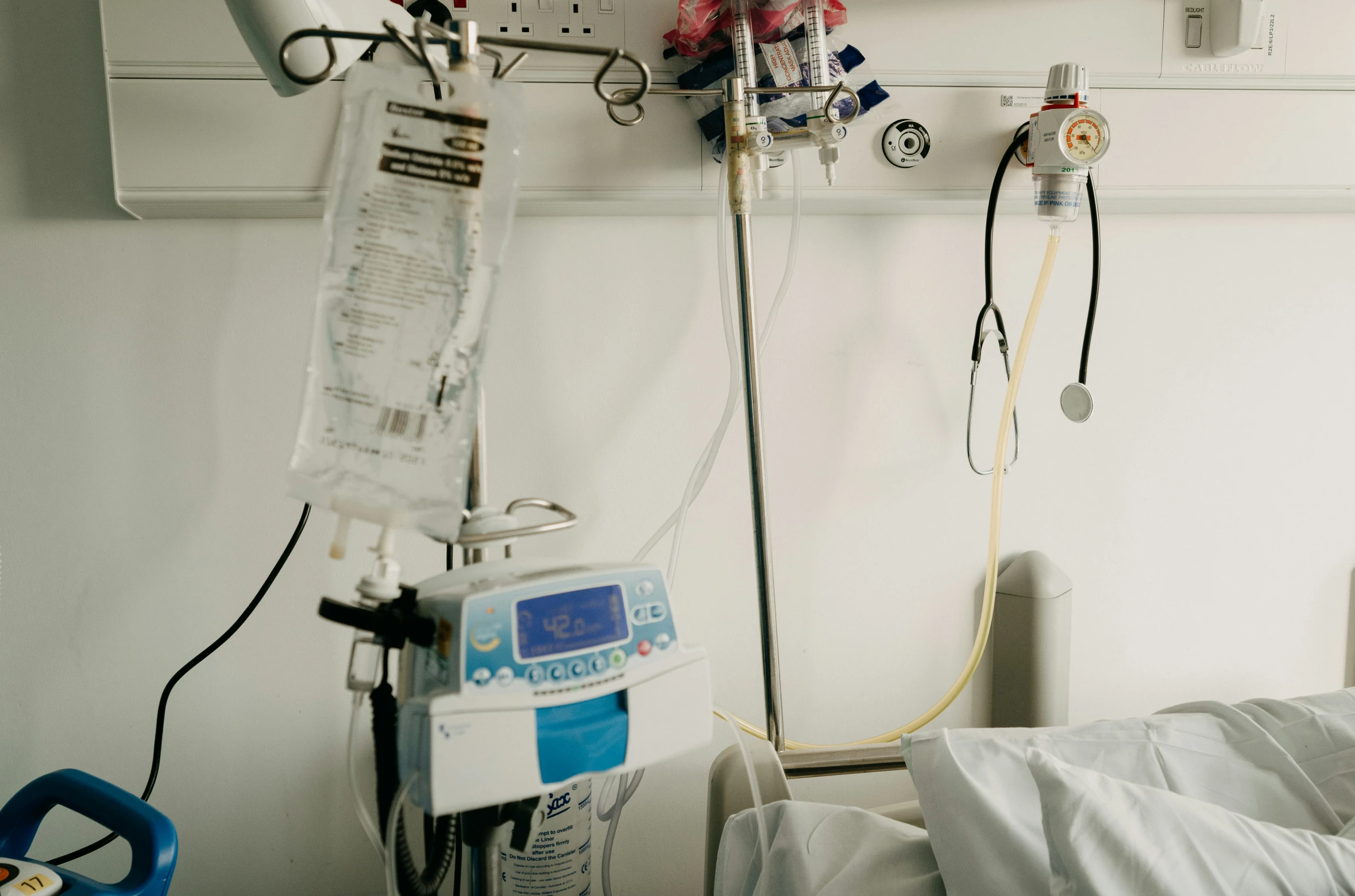 a medical room with various medical devices on the wall