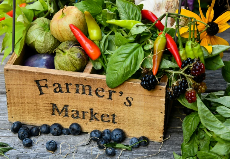 a wooden box filled with lots of fresh produce