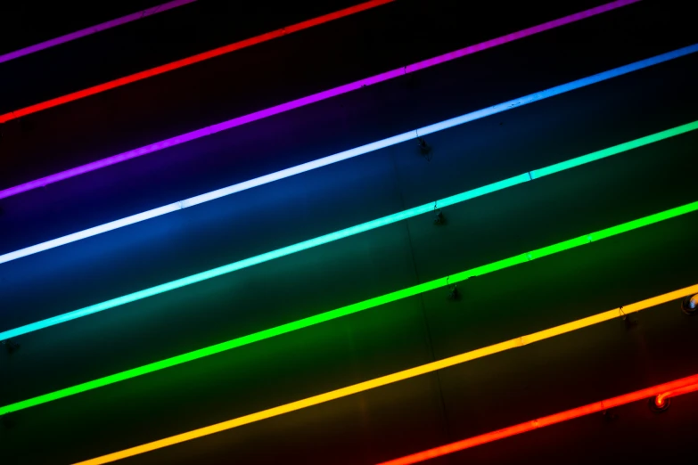 an illuminated wall with bright lines of color