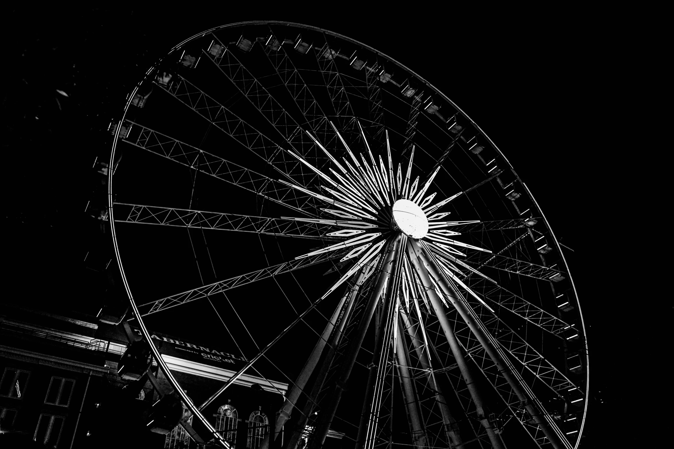 a black and white po of a ferris wheel