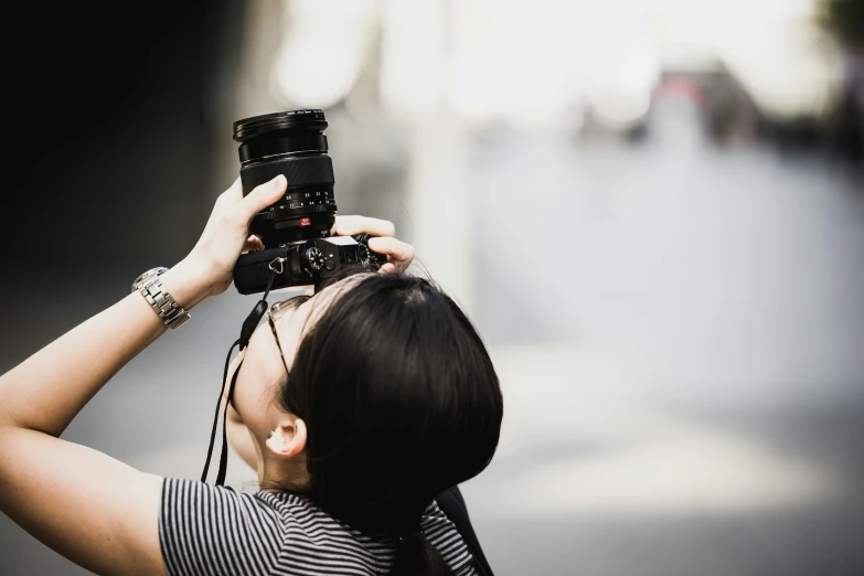 a woman taking a picture with her camera