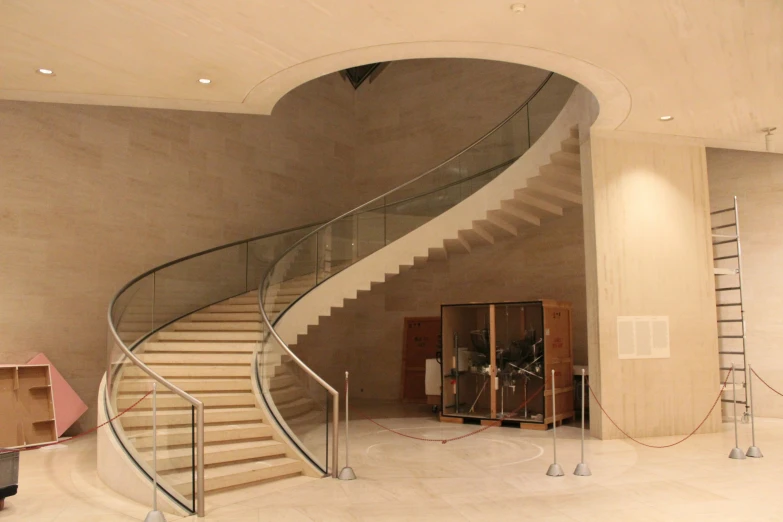 a modern staircase leads to a second story