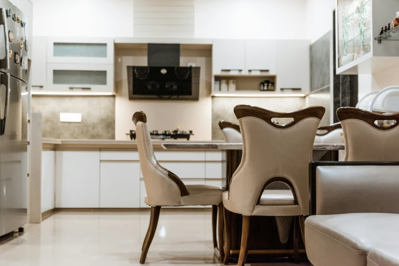 an elegant dining table and chairs in a living room