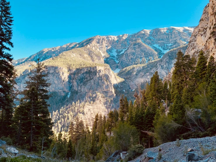 the view of some mountains on a clear day