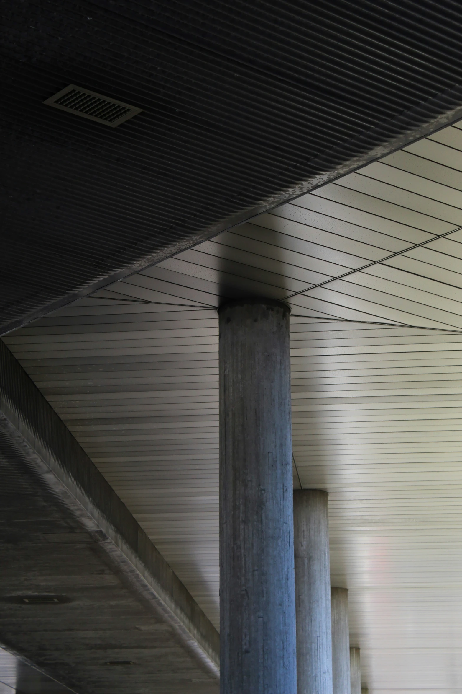 some pillars and the ceiling of a building