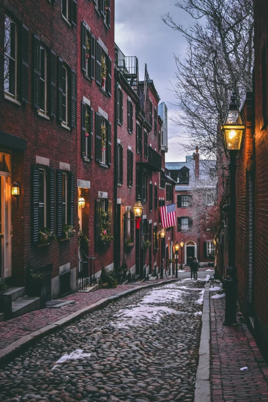 an empty cobblestone road in a small town