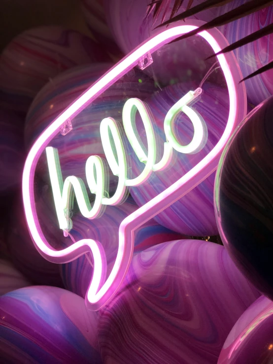 a purple neon sign that says balloon in a bubble