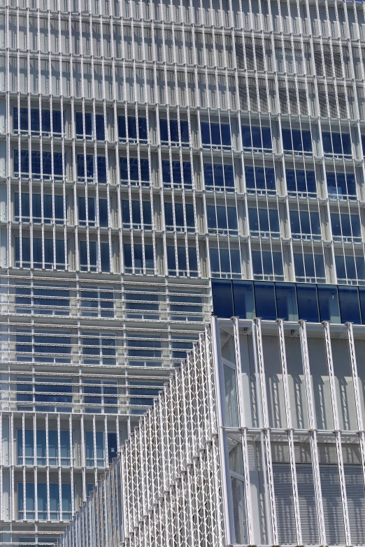 an abstract building with blue windows next to another building