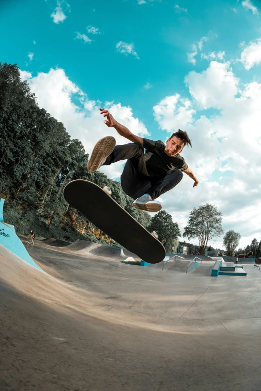 a guy on a skateboard doing tricks in the air