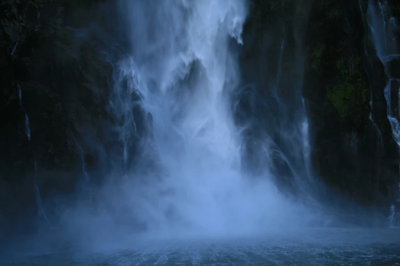 there is a large waterfall coming out of the water