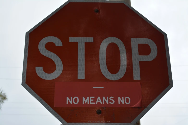a red stop sign with the word means no