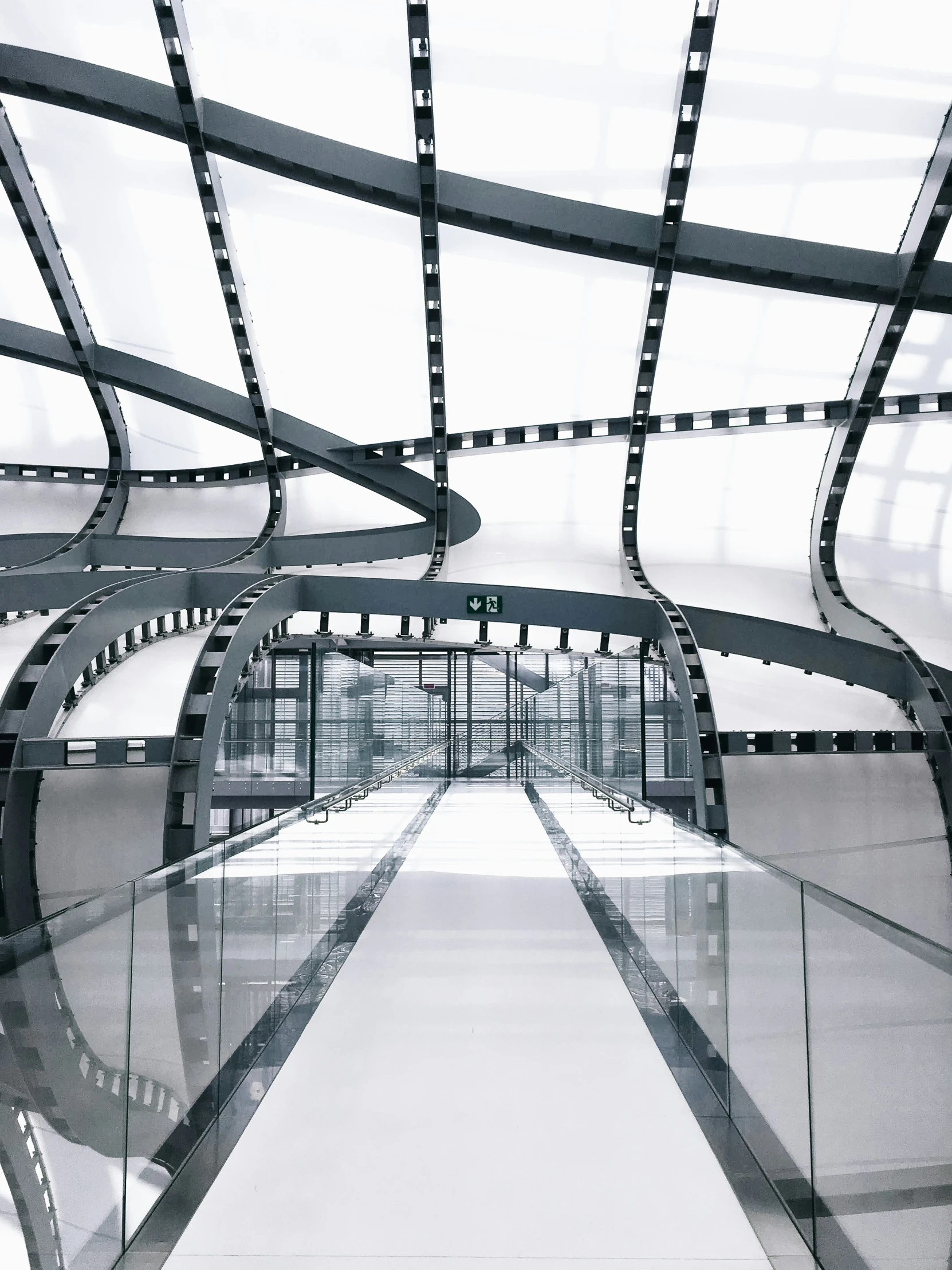 black and white pograph of a walkway in a building