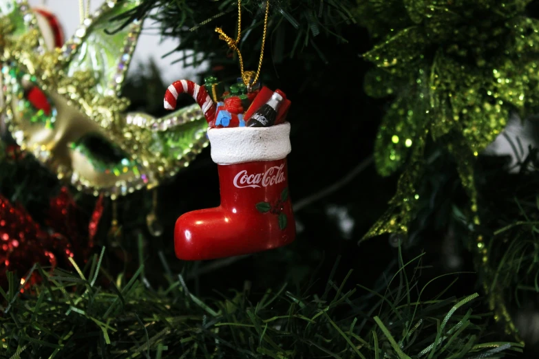 an ornament hanging from the tree on a christmas tree