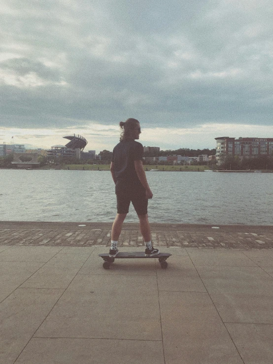 a person on a skateboard near a body of water