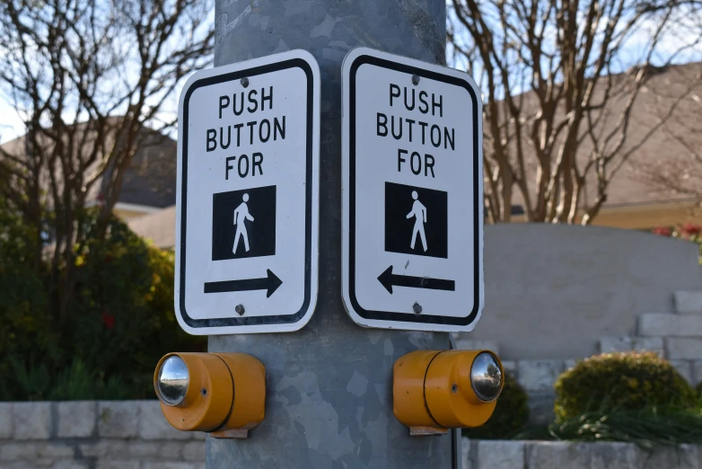 two street signs are mounted to the pole