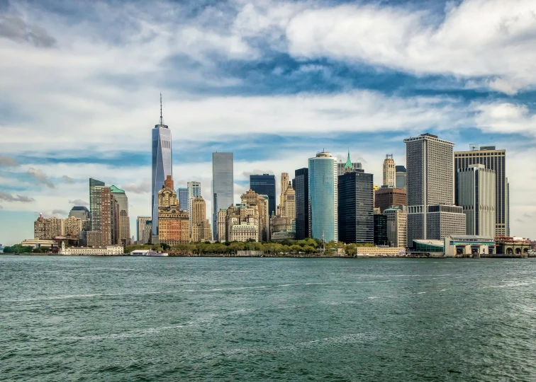 a view of the skyline of manhattan from a boat